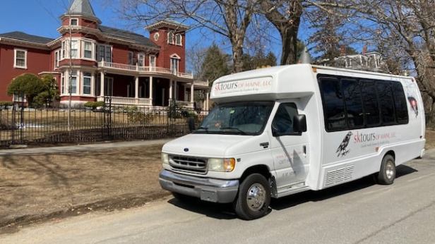 a van parked on the side of a road