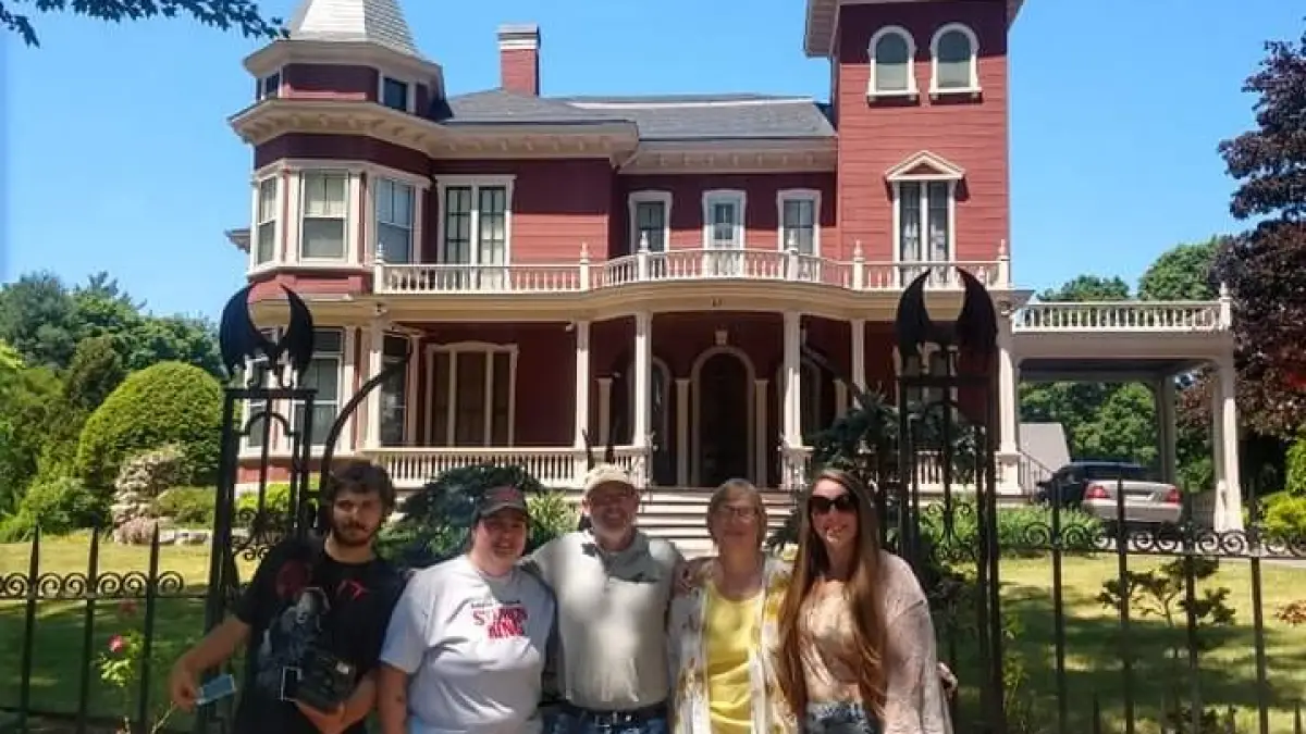 a group of people standing in front of a building