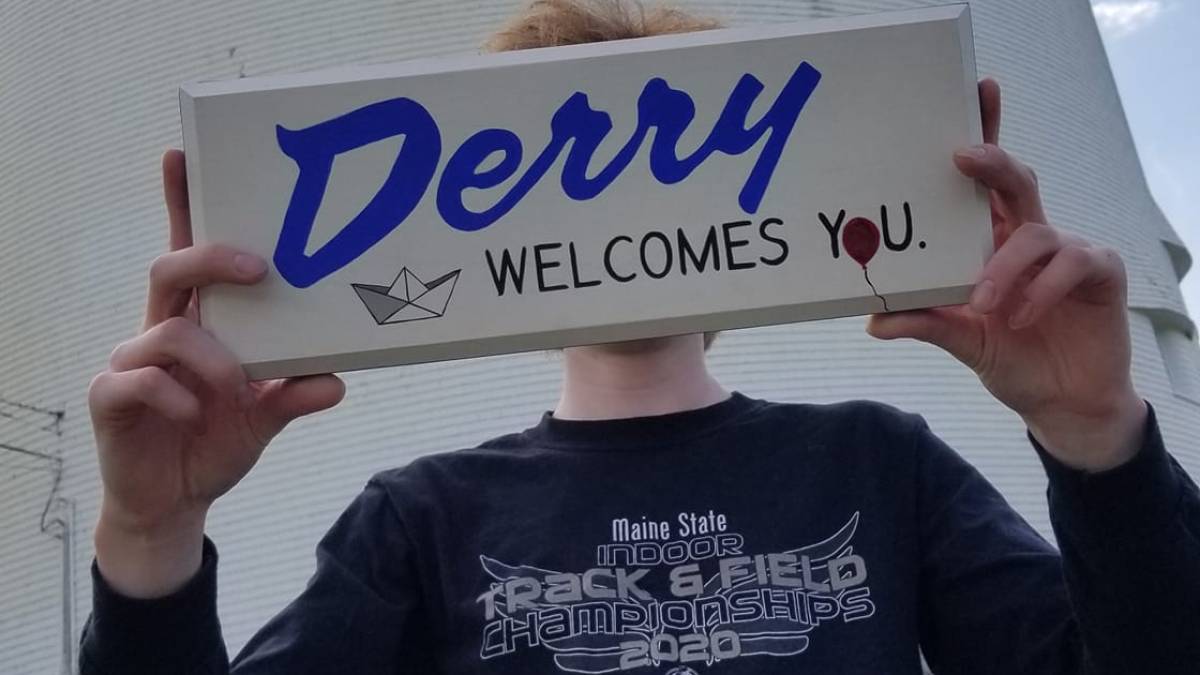 a man holding a sign