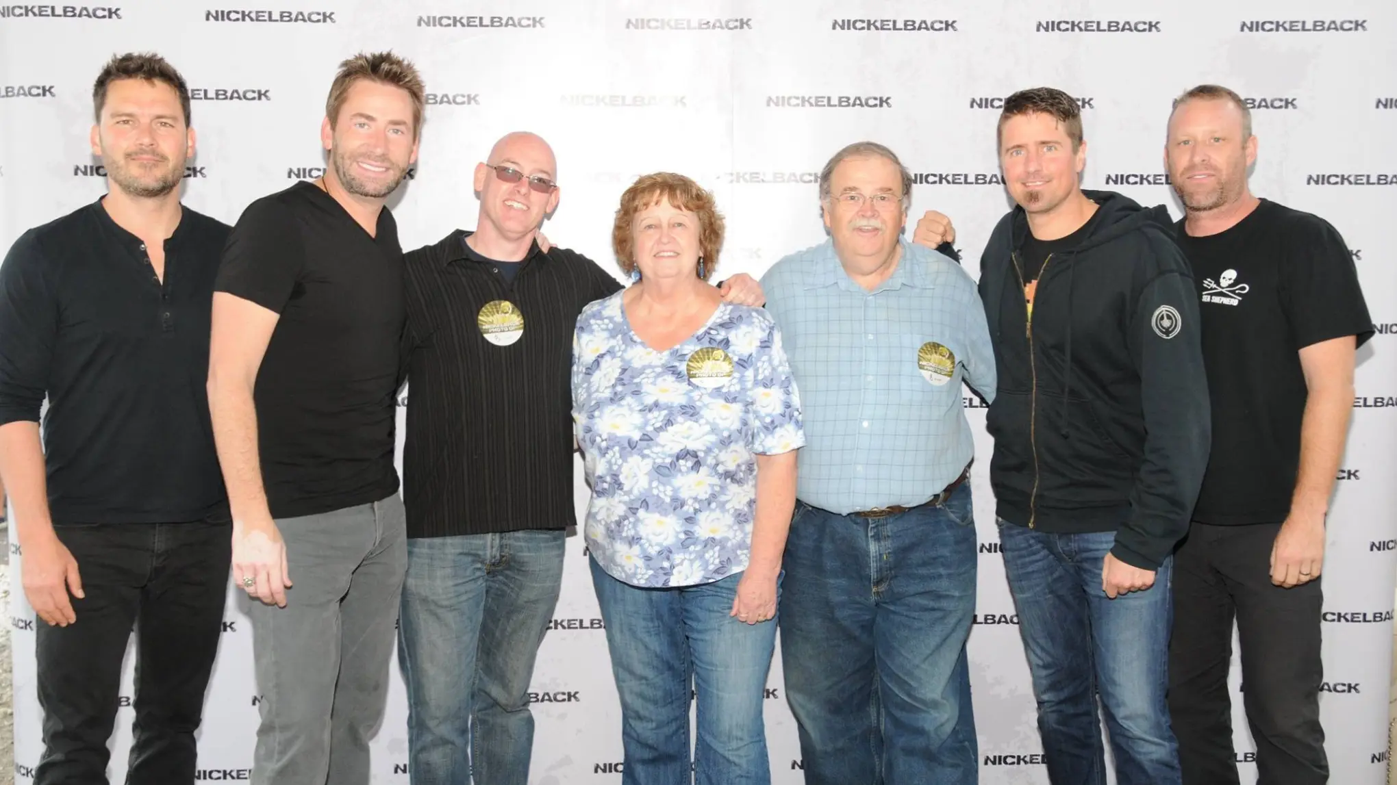 Ryan Peake, Chad Kroeger, Daniel Adair, Mike Kroeger posing for a photo