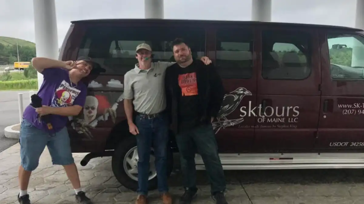 a group of people riding on the back of a truck