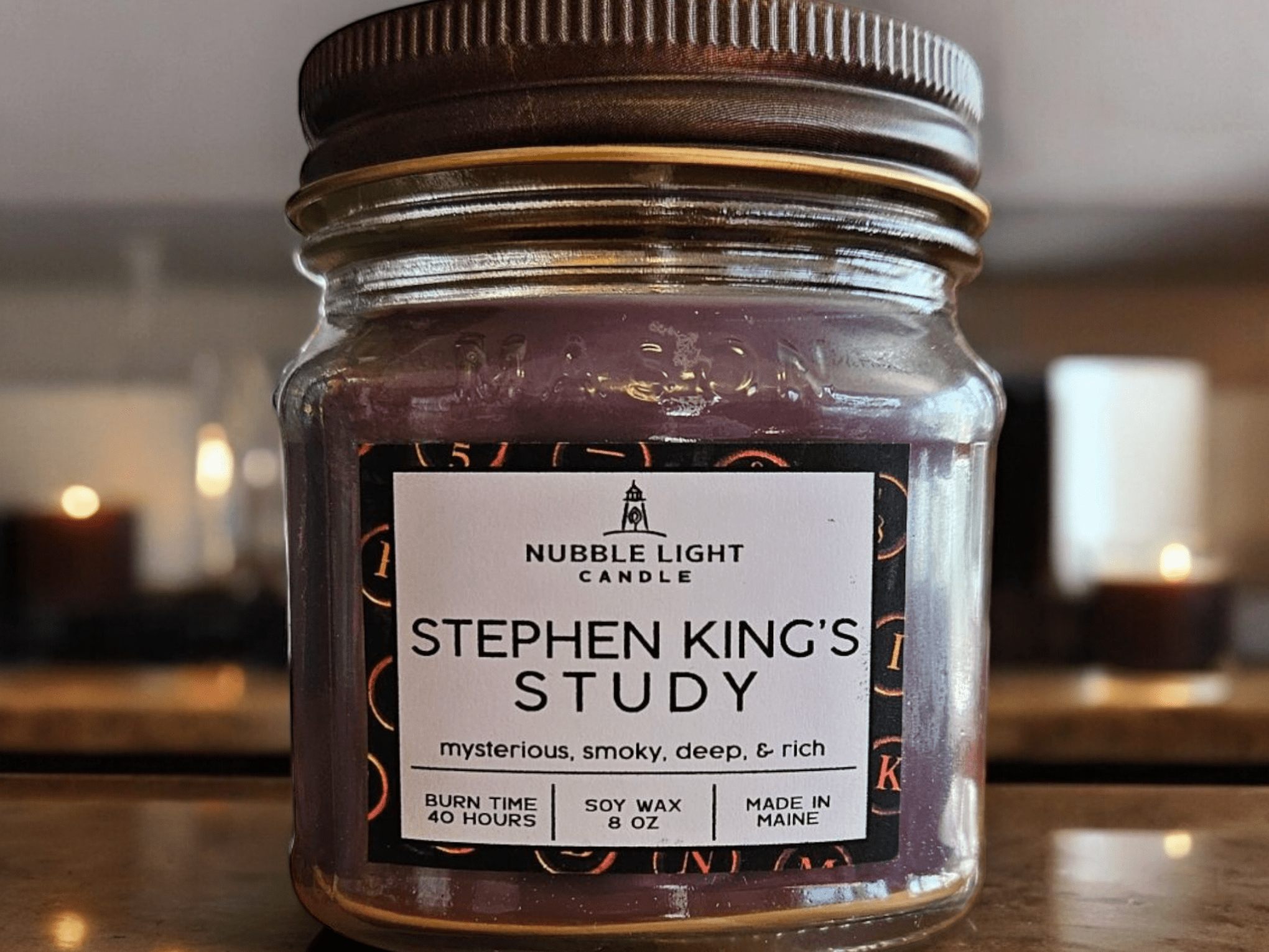 a glass bottle sitting on a table